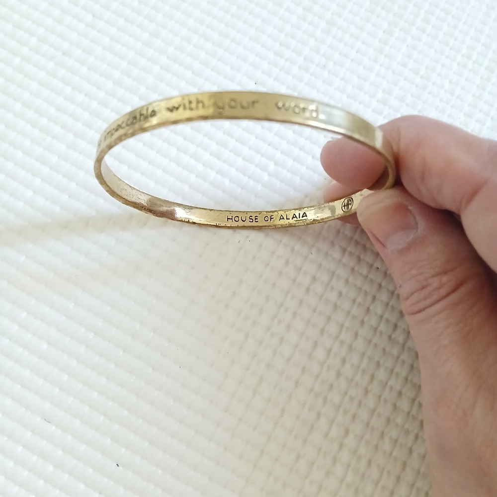 House of Alaia brass bangle bracelet- "Be impeccable with your words" Rare, Mint